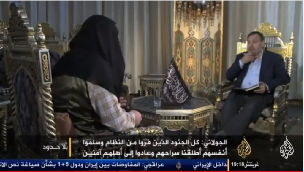 Fermo immagine da al Jazeera dell'intervista ad Abu Mohammed al Julani