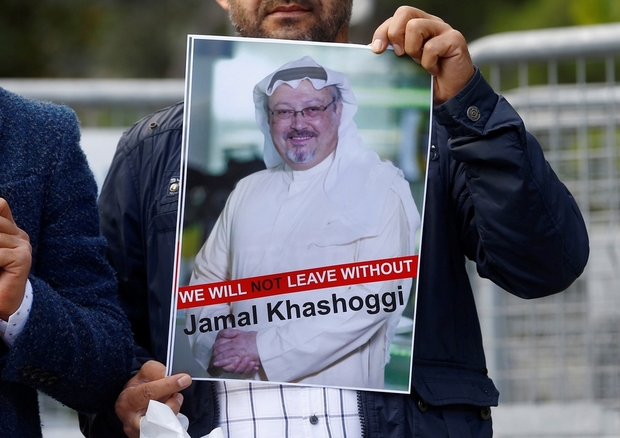 A demonstrator holds picture of Saudi journalist Jamal Khashoggi during a protest in front of Saudi Arabia's consulate in Istanbul